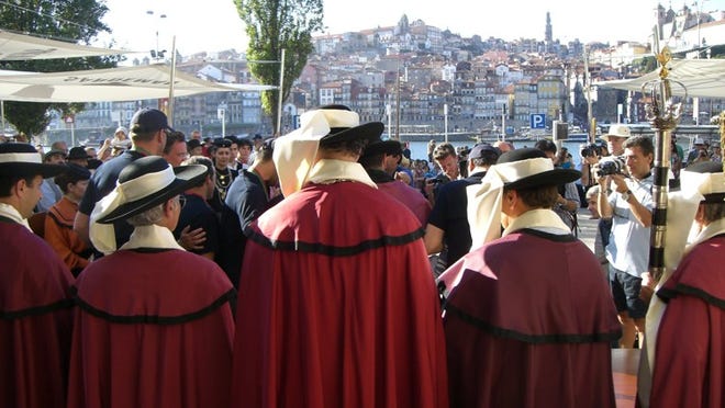 The Conifraria do Vinho Do Porto at the awards ceremony, seen against the skyline of Porto.