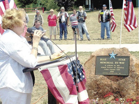 Karen Gentile, District 11 director of the Michigan Garden Club, discussed the Blue Star Memorial at a dedication ceremony Wednesday at Colon Park.