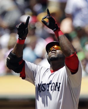 Boston’s David Ortiz points to the sky Wednesday after hitting his 400th home run in a 3-2 loss to Oakland.