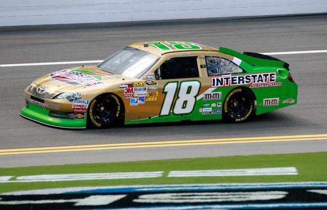 Kyle Busch drives around the track Thursday during practice for the Coke Zero 400 aat Daytona International Speedway.