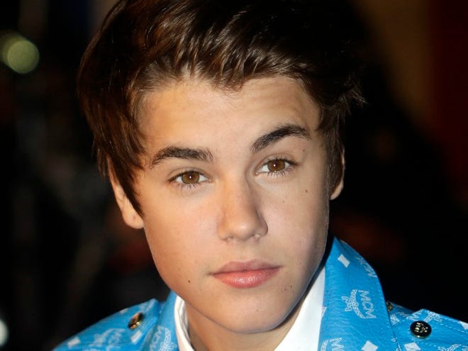 Canadian singer Justin Bieber arrives at the Cannes festival palace to attend the NRJ Music awards ceremony, in Cannes, southeastern France, on Jan. 28, 2012. (AP Photo/Lionel Cironneau, File)