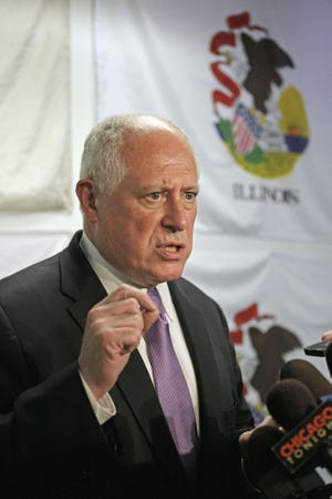 Illinois Gov. Pat Quinn talks with reporters Wednesday, June 6, 2012, in Chicago after a meeting with top Illinois lawmakers to discuss pension reforms. The lawmakers left the meeting divided over what approach to take. They were close to agreement last week, but that was derailed shortly before the end of the legislative session. The biggest dispute is over whether to make downstate and suburban Chicago schools take over the cost of employee pensions. Illinois pays those expenses now. (AP Photo/M. Spencer Green)