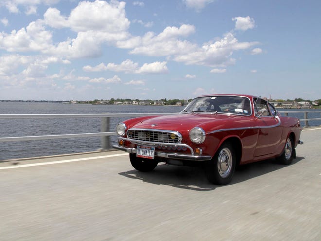 Irv Gordon drives his Volvo P1800 in Babylon, N.Y., Monday, July 2, 2012. Gordon's car already holds the world record for the highest recorded milage on a car and he is less than 40,000 miles away from passing three million miles on the Volvo.  (AP Photo/Seth Wenig)