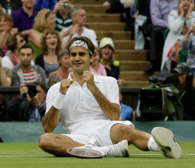 Roger Federer reacts after defeating Andy Murray Sunday at Wimbledon.
