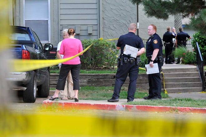 Amarillo Police officers collect evidence and gather statements Monday after a shooting and suicide at Huntington Pointe Apartments, 6801 Wolflin Ave.