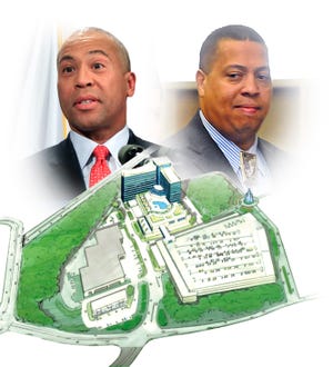 Gov. Deval Patrick, left, and the Mashpee Wampanoag Tribe, whose tribal Chairman Cedric Cromwell is at right, reached a casino compact on Wednesday, July 10, 2012. The compact, which would govern the operation of a proposed tribal casino in Taunton, calls for 21.5 percent of gross gaming revenue from the tribe to go to the state. A 6.5 percent share of that amount would be used for mitigation in communities affected by the casino, but no specific projects are identified.