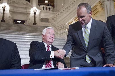 Pennsylvania Governor Tom Corbett shakes hands with Rep Mike Turzai, majority leader, after signing the 2012-13 state budget during a ceremony in the Capitol Rotunda June 30. (AP Photo/Joe Hermitt, The Patriot-News)