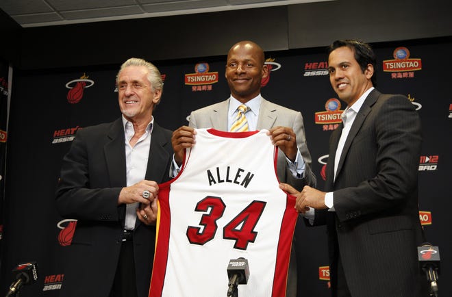 Miami Heat oresident Pat Riley, left, guard Ray Allen, center, and head coach Erik Spoelstra, hold up Allen's jersey after Allen signed a contract with the Miami Heat on Wednesday.