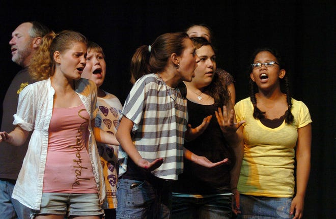 Chorus members rehearse a scene from the Little Theater on Broad Street production of "Big, The Musica"l Tuesday at the Killingly Community Center. See more photos at NorwichBulletin.com John Shishmanian/ NorwichBulletin.com