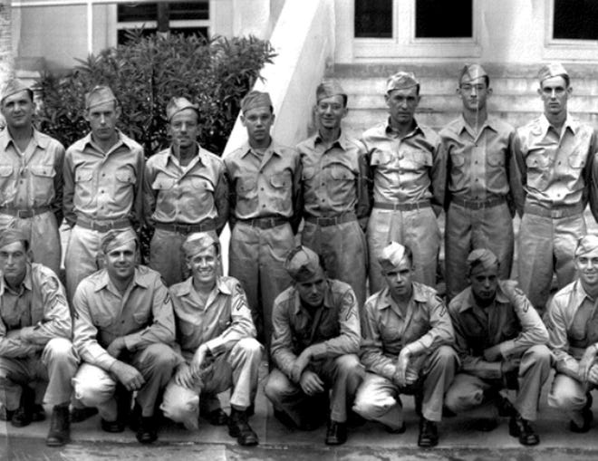 Leo Gagne, kneeling at third from the left, poses for a photo with his fellow members of the Army Air Corps. Gagne was a prisoner of war of the German Army during World War II for nine months and was forced to take part in the Death March across Eastern Europe in 1945.
