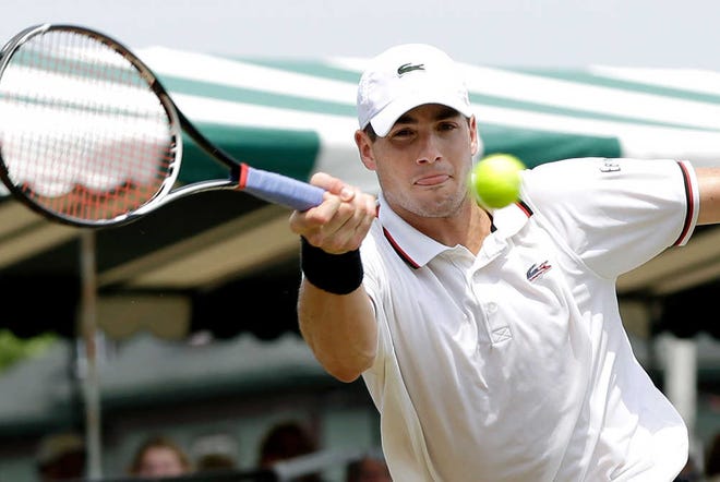 Top-seed John Isner of the USA, returns the ball to Izak Van Der Merwe of South Africa, during a quarterfinal match at the Hall of Fame tennis championships in Newport, R.I. Friday, July 13, 2012. Isner won 6-4, 7-6 (2). (AP Photo/Elise Amendola)