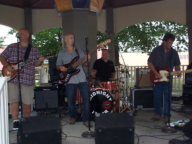 The Thirsty Brothers, a southern rock band, performs the Hank Williams Jr. tune, "Family Tradition," during a Music in the Park event held Friday in Jones Park, downtown Canton. Music in the Park events are sponsored by Canton Area Chamber of Commerce.