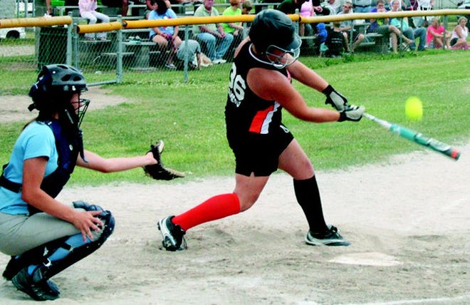 Cheboygan’s Kamie Ramsay (right)?takes a swing during Saturday’s Junior Girls (13-15)?District 13 championship game against Sault Ste. Marie held in Cheboygan.
