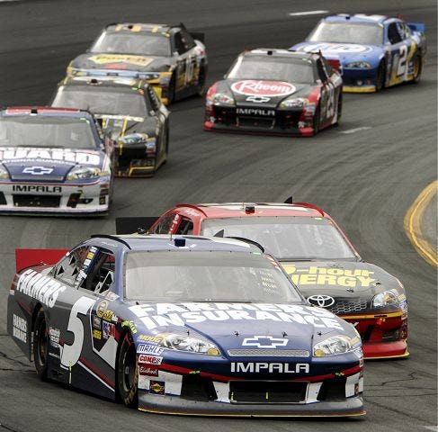 AP photo
Kasey Kahne, 5, takes the lead following a restart during the NASCAR Sprint Cup Series auto race Sunday at New Hampshire Motor Speedway in Loudon.