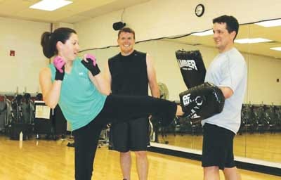 Submitted Photo - Lauren and Andy Fraser practice kickboxing at the YMCA. Lauren was part of Team WWW, which won this season’s fitness challenge at Laddey, Clark & Ryan.