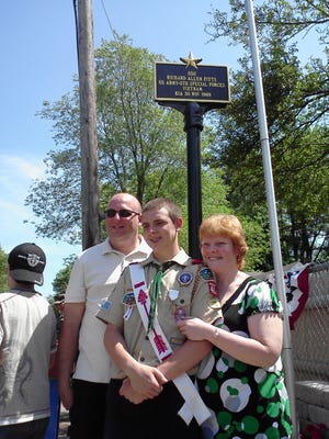 On Sunday, Abington re-dedicated the U.S. Army Staff Sgt Richard A. Fitts memorial at Fitts Memorial Drive in Abington. Abington Eagle Scout Michael Wenners, center, built the memorial project after raising $2,000 for materials and supplies. He is accompanied by his parents, Mark and Ellen Wenners.