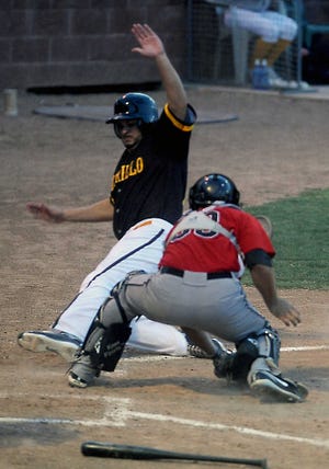 Amarillo Sox's Chuck Lofgren, left, slides safely past El Paso Diablos catcher Patrick Arlis to score a run in their American Association game Tuesday night at Amarillo National Bank Sox Stadium. The teams were tied at 9-9 after 14 innings, when the game was halted at 12:17 a.m. Wednesday and set to resume at 6:05 p.m. Wednesday.