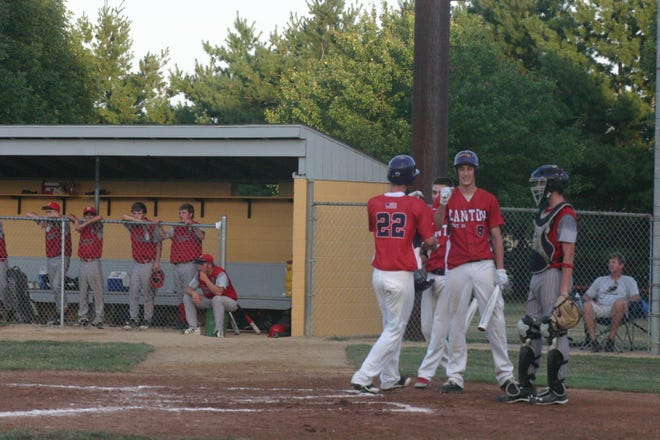 Cody Smith, at left, gets congratulated by Jake Randall after Smith hit a two-run home run in the first inning in Post 16's American Legion District 15 game against Farmington on Tuesday. Smith wasn't done for the night either as he hit a grand slam home run in the second inning in what turned into a 15-3 victory over Post 140.