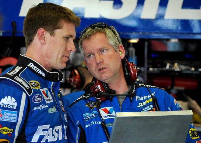 Carl Edwards, left, speaks with crew chief Bob Osborne during practice for the Daytona 500 in February. Citing heath concerns, Osborne has stepped down, and Chad Norris will be Edwards' new crew chief.