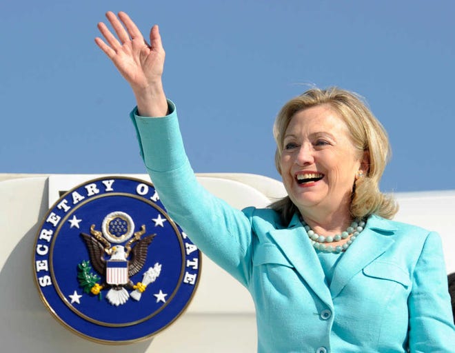 In this June 10 photo, Secretary of State Hillary Rodham Clinton waves as she arrives at Lusaka International Airport in Lusaka, Zambia. If diplomatic achievements were measured by the number of countries visited, Clinton would be the most accomplished secretary of state in history. Since becoming secretary of state in 2009, she has logged 351 days on the road, traveled to 102 countries and flown a whopping 843,839 miles.