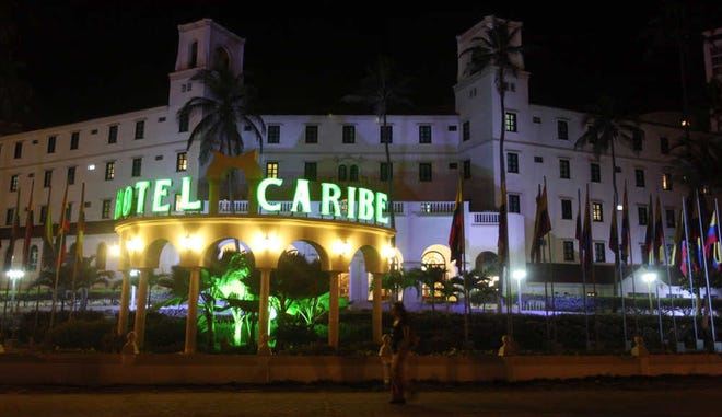 In this April 19 photo, people walk past Hotel El Caribe in Cartagena, Colombia. Seven Army soldiers and two Marines have received administrative punishments, but are not facing criminal charges, for their part in the Secret Service prostitution scandal in Colombia this year, The Associated Press has learned. U.S. officials said that one Air Force member has been reprimanded but cleared of any violations of the Military Code of Justice. And final decisions are pending on two Navy sailors, whose cases remain under legal review.