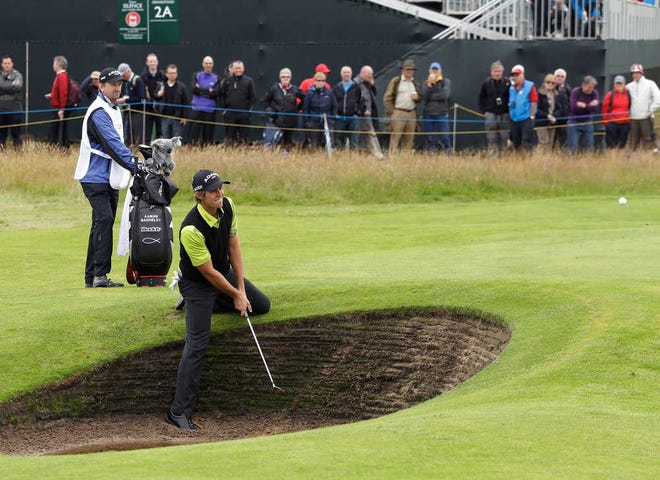 Aaron Baddeley of Australia prepares to play out of the bunker on the second hole at Royal Lytham & St Annes golf club during the second round of the British Open Golf Championship, Lytham St Annes, England, Friday, July 20, 2012. (AP Photo/Jon Super)