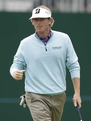 Peter Morrison Associated Press Brandt Snedeker gives a fist pump after putting on the 18th green at Royal Lytham & St Annes during the second round of the British Open on Friday.