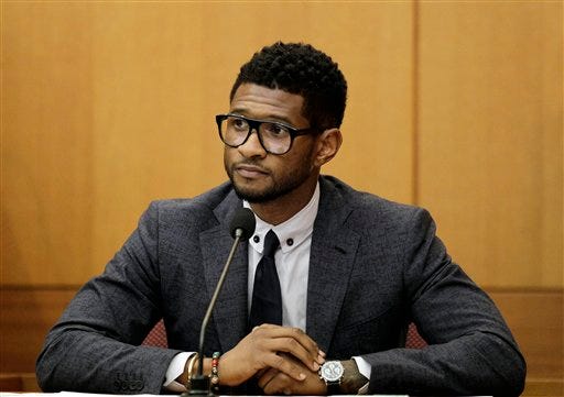Hip-hop artist Usher Raymond takes the witness stand in court in a legal battle with his ex-wife in a custody fight involving their two sons in this May 22, 2012 file photo taken in Atlanta. Willie A. Watkins funeral home in Atlanta confirmed Saturday July 21, 2012 it is handling funeral arrangements for 11-year-old Kirk Glover. He was the son of Usher's ex-wife Tameka Foster. The boy was run over July 6 by a personal watercraft on Lake Lanier, according to the Georgia Department of Natural Resources. (AP Photo/David Goldman, File)
