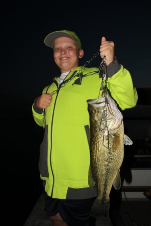 Liam Hill, 13 of Plain Township, caught this 22-inch, 7.8 pound largemouth bass while fishing on Cayuga Lake (Finger Lakes) in New York during a family July 4th vacation. Hill caught the bass at 9 p.m. using a worm. The New York state record is 25.5.