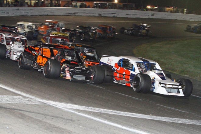 Keith Rocco, left, and Shawn Monahan, right, battle for position during the SK Modified race Saturday night at the Waterford Speedbowl.
