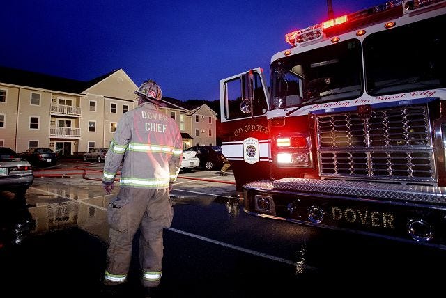 Julian Russell/Staff photographer Dover Fire Chief Richard Driscoll weighs the situation at a gas leak incident at the Royal Commons apartment complex on Webb Place in Dover Monday night.