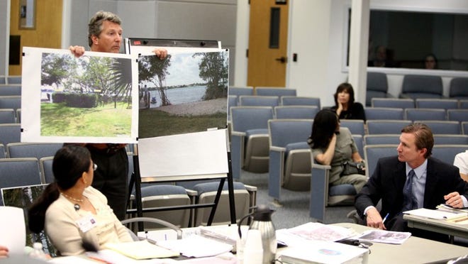 Roger Byrd watches his attorney during a code compliance hearing in front of a magistrate at Jupiter Town Hall in 2011.