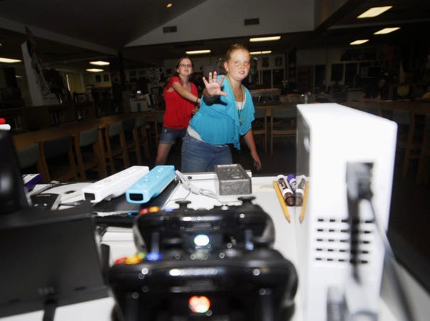 Joey Shaver (front) and Jennifer Heuer, students at Myrtle Grove Middle School, play Kinect for Xbox, one of the many video gaming consoles Myrtle Grove uses.