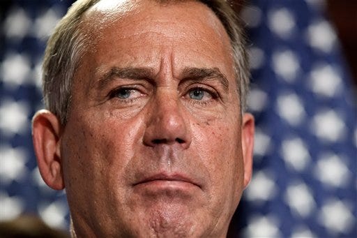 n this July 24, 2012, photo, House Speaker John Boehner, R-Ohio, talks to reporters following a closed-door political strategy session at the Capitol in Washington. The Senate is bracing for a tax-cut showdown that is all about Democrats and Republicans showing voters their differences over taxing the well-off while accusing each other of threatening to shove the government over a fiscal cliff. Senators planned to vote Wednesday, July 25 on a $250 billion Democratic bill that would extend expiring tax cuts next year for all but the highest earners. Republicans were forcing Senate Majority Leader Harry Reid, D-Nev., to corral 60 votes for the proposal, which he does not have. Boehner was ready to push legislation through his chamber next week that closely mirrors the Senate GOP measure. (AP Photo/J. Scott Applewhite)