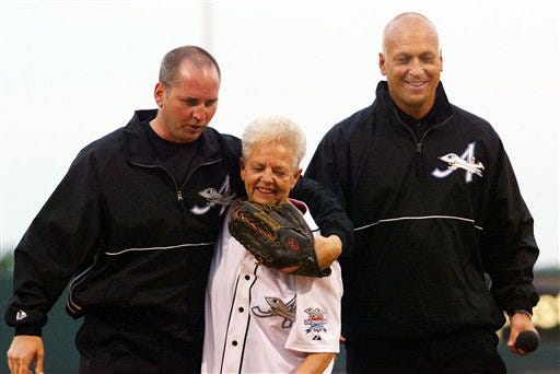 This June 18, 2002 file photo shows Cal Ripken Jr., right, owner of the Aberdeen IronBirds, and his brother, Bill, walking off the field with their mother, Vi, after she threw out the ceremomial first pitch prior to the team's season-opening debut at the new Ripken Stadium in Aberdeen, Md. Police say Cal Ripken Jr.'s mother is safe after an armed man abducted her from her home northeast of Baltimore. Aberdeen police say 74-year-old Vi Ripken was kidnapped between 7 a.m. and 8 a.m. Tuesday, July 24, 2012, by a man who forced her into her car. (AP Photo/Roberto Borea, File)
