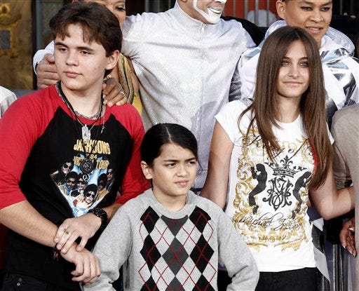 This Jan. 26, 2012 file photo shows, from left, Prince Jackson, Blanket Jackson and Paris Jackson after a hand and footprint ceremony honoring their father musician Michael Jackson in front of Grauman's Chinese Theatre in Los Angeles. The executors of Michael Jackson's estate say they are concerned about the welfare of the singer's mother and his three children. In a letter posted on fan sites Tuesday, July 24, executors John Branca and John McClain says they are doing what they can to protect them from "undue influences, bullying, greed, and other unfortunate circumstances." The letter came hours after sheriff's deputies responded for a family disturbance at the hilltop home where Katherine Jackson and her three grandchildren live. No arrests were made, but there is an active battery investigation. Katherine Jackson was reported missing over the weekend, but is with relatives in Arizona. (AP Photo/Matt Sayles