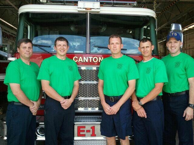 Members of Canton Fire Department show the Fragile X T-shirts they are wearing at work this week. From left are Lt. Al Devlin, Firefighter Keith Deppermann, Lt. Scott Roos, Assistant Fire Chief Tom Shubert and Firefighter Lance Lusk.