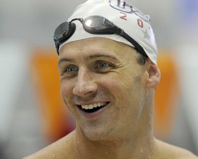 U.S. Olympic swim team member Ryan Lochte enjoys a laugh with teammates before practice at the University of Tennessee's Allan Jones Aquatic Center, Thursday, July, 12, 2012, in Knoxville, Tenn. (AP Photo/Knoxville News Sentinel, Michael Patrick)