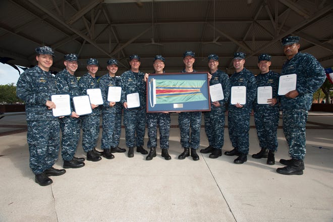 From left, Capt. Christopher Harkins, commodore, Submarine Squadron 20; Cmdr. Sean Muth, commanding officer USS Rhode Island Gold; Cmdr. Robert Wirth, commanding officer USS Alaska Gold; Cmdr. Richard Dubnansky, commanding officer, USS Tennessee Gold; Cmdr. Brett Moyes, commanding officer, USS Tennessee Blue; Rear Adm. Joseph Tofalo, commander, Submarine Group 10; Vice Adm. John Richardson, commander, Submarine Force; Cmdr. Andrew Kimsey, commanding officer, USS Maryland Gold; Cmdr. Doug Adams, commanding officer, USS Rhode Island Blue; Cmdr. Barry Rodrigues, commanding officer, USS Wyoming Blue; Cmdr. Vincent Webster, executive officer, Naval Submarine Support Center Kings Bay, participate in the award ceremony.