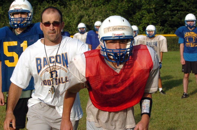 Former Bacon Academy coach Duane Maranda, seen in a 2009 photo with Trey Geisman, right, and Will Bartol, is headed to New London to take over that program after coach Jeff Larson left to become an administrator at Hartford Classical. Maranda coached the St. Bernard/Norwich Tech cooperative for three years before spending the last six seasons at Bacon.