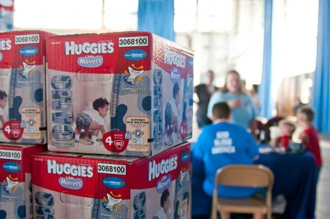 Huggies partnered with the Armed Services YMCA, a military, non-profit organization that makes military life easier with free programs and services to servicemembers and their Families nationwide, by hosting Huggies Camo for a Cause. ASYMCA at Fort Bragg, received hundreds of boxes containing camo-styled diapers to give to junior enlisted military Families (E-5 and below), July 17, in Hangar 4 on Pope Field.