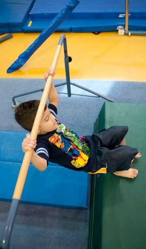 Nathaniel Greenberg, 4, enjoys completing a flip July 16, during summer Tumbling Academy at Tolson Youth Activities Center.