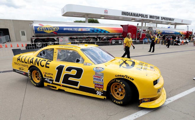 Nationwide Series driver Sam Hornish Jr. returns to his garage during practice Thursday for today's Nationwide Series Indiana 250 auto race at the Indianapolis Motor Speedway in Indianapolis.