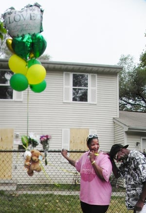 Charla King-Jackson and Joseph Bell remember their cousin, George Nichols, 43, who perished in a fire at his home Saturday morning. A vigil will be held at the home, 427 S. Shelley St. at 7 p.m. Saturday.