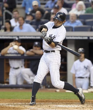 Ichiro Suzuki flies out in his first home at-bat as a Yankee on Friday during the second inning of a 10-3 win over the Red Sox at Yankee Stadium in New York.