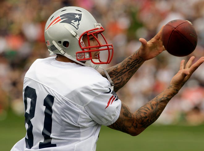 Patriots tight end Aaron Hernandez pulls in a pass during practice on the second day of Friday'straining camp in Foxboro.