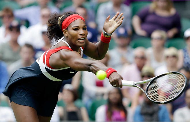 Serena Williams returns the ball during her first-round Olympic victory against Jelena Jankovic on Saturday in Londong. Watching her were first lady Michelle Obama, right, and former USA gymnast Dominique Dawes.