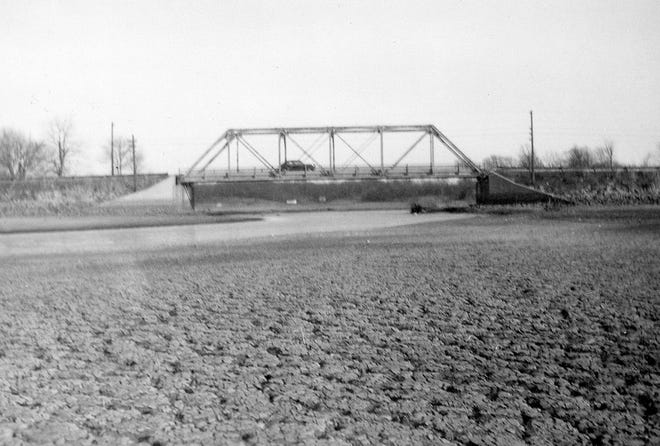 Lake Springfield is just a trickle under the original iron bridge on Iron Bridge Road when the lake was at its lowest level on record in the winter of 1954-1955. Photo submitted by Bob Reynolds of Springfield.