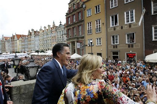 Republican presidential candidate, former Massachusetts Gov. Mitt Romney and wife Ann wave to the crowd at The Gdansk Old Town Hall, in Gdansk, Poland, Monday, July 30, 2012. (AP Photo/Charles Dharapak)