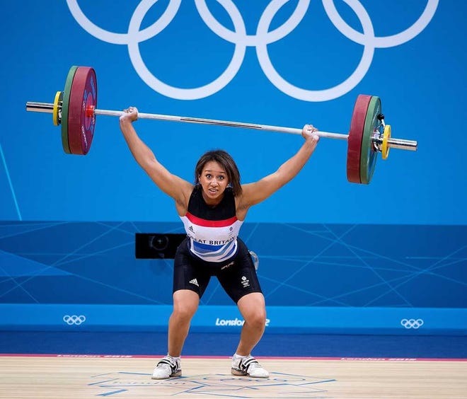 Harry E. Walker MCT  Great Britain's Zoe Smith buckles under the weight of 93 kilograms in the Women's 58 kg division of weightlifting on Monday. China's Li Xueying won the gold medal; Smith finished in 12th place.